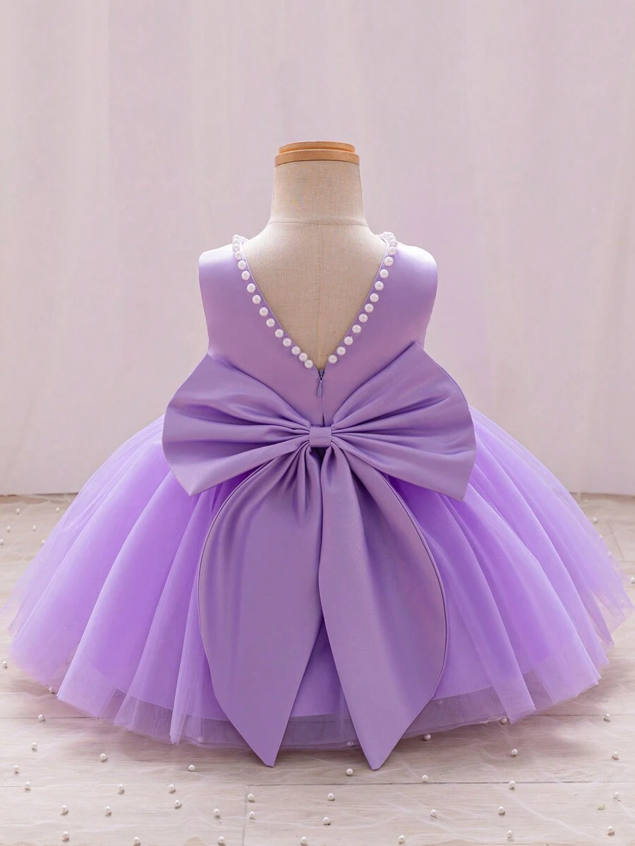 SHEIN Glamorique Kids 女婴圣诞公主裙、舞会礼服、派对和婚礼花裙、粉色薄纱泡泡裙、白色串珠 V 形后背大蝴蝶结公主礼服婴儿紫色连衣裙 - 紫色 - 查看 1