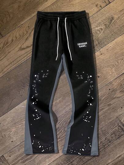 Manfinity Roghcode Pantalon de survêtement droit décontracté noir à taille coulissante avec poche latérale, imprimé lettres, pour sortir, streetwear color block, cadeau pour mari, petit ami, pour rave