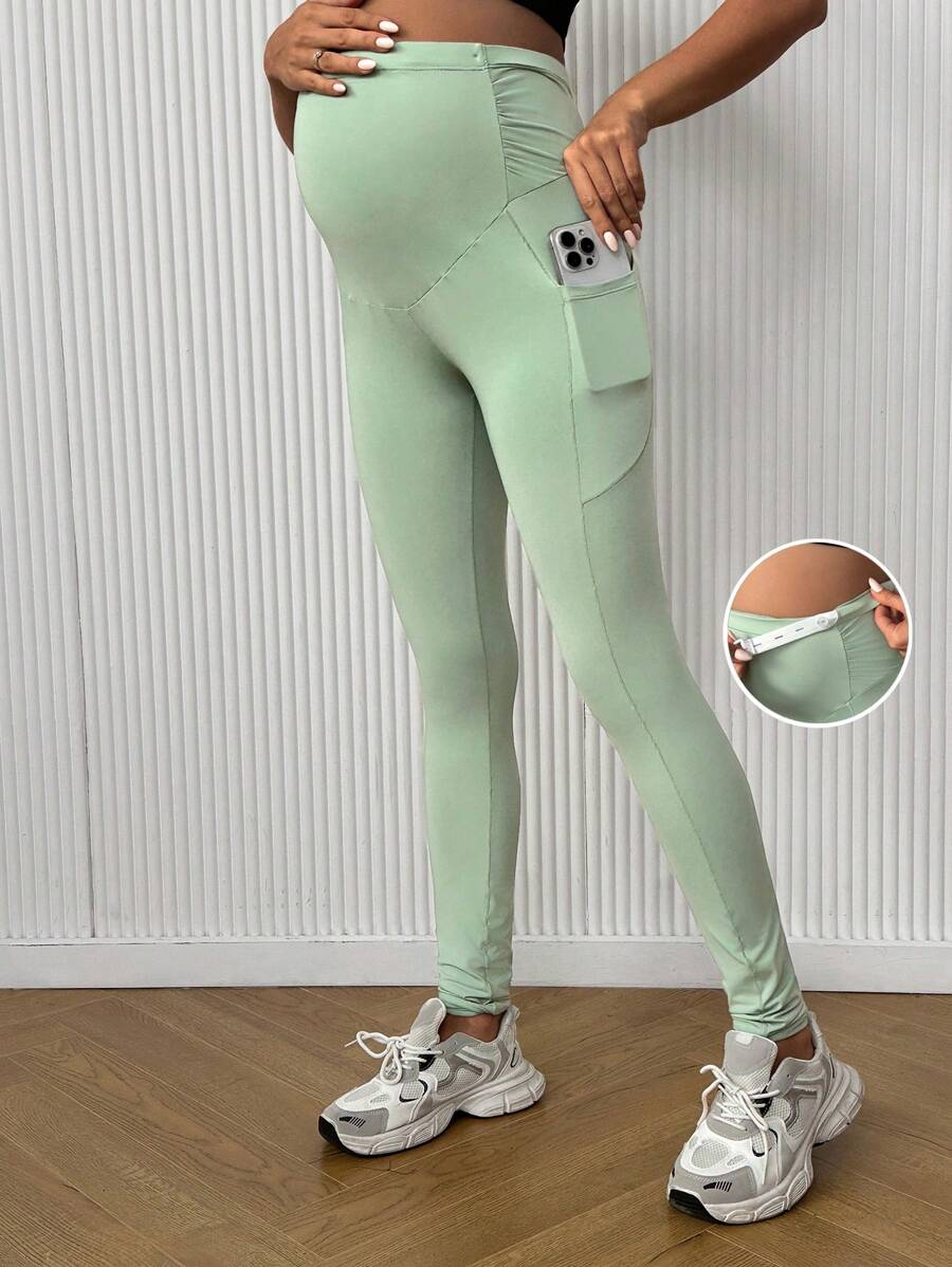 SHEIN Bộ đồ thể thao bà bầu màu trơn có túi xếp ly, mặc thường ngày - Màu xanh Bạc hà - Xem 1