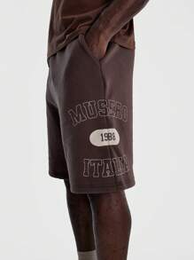 Musero Pantalones cortos tipo jogger de corte holgado con estampado gráfico para hombre