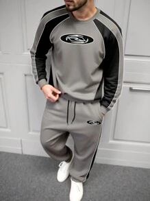 Manfinity LEGND Conjunto casual de sudadera y pantalón de chándal con cuello redondo y manga raglán con estampado de letras para hombres talla grande, otoño