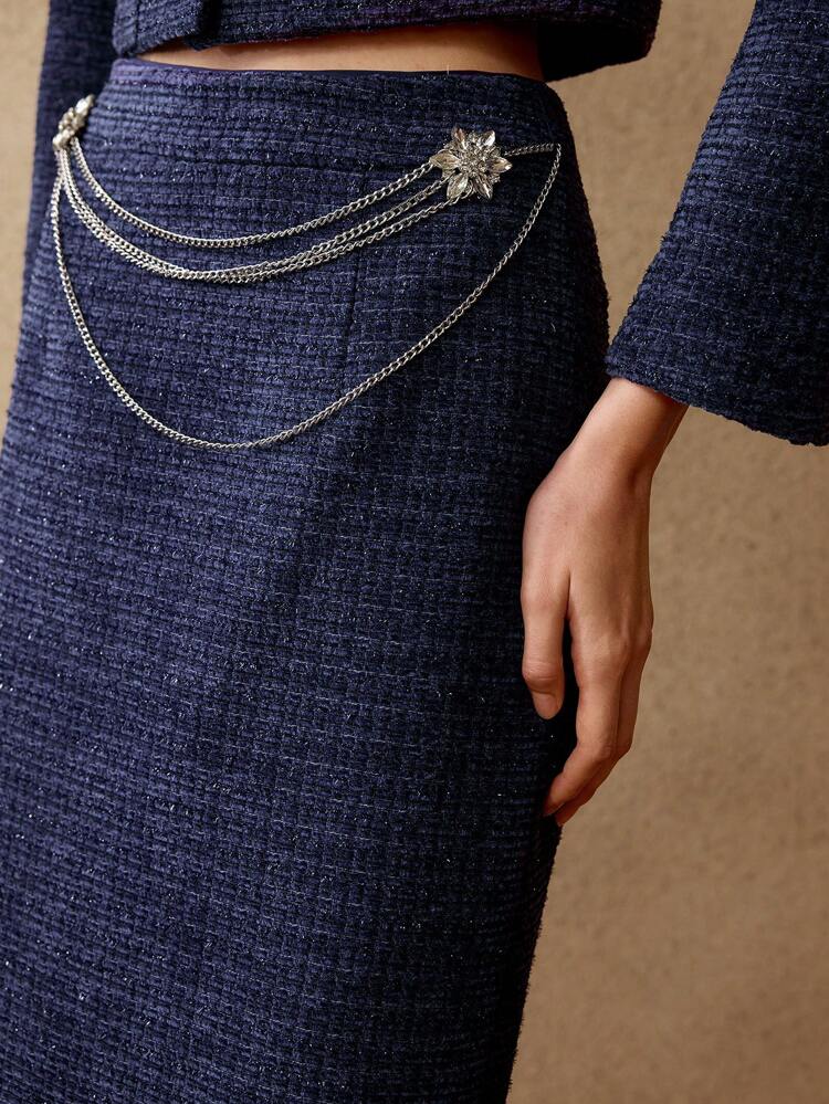 Falda recta con abertura trasera de tweed con cadena de strass