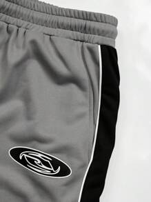 Manfinity LEGND Conjunto casual de sudadera y pantalón de chándal con cuello redondo y manga raglán con estampado de letras para hombres talla grande, otoño