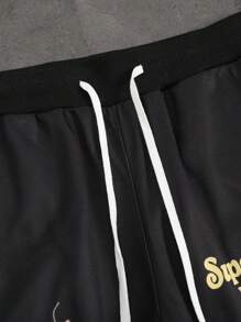 Manfinity EMRG Pantalones deportivos casuales con cordón en la cintura y estampado de letras y pentagramas para hombre