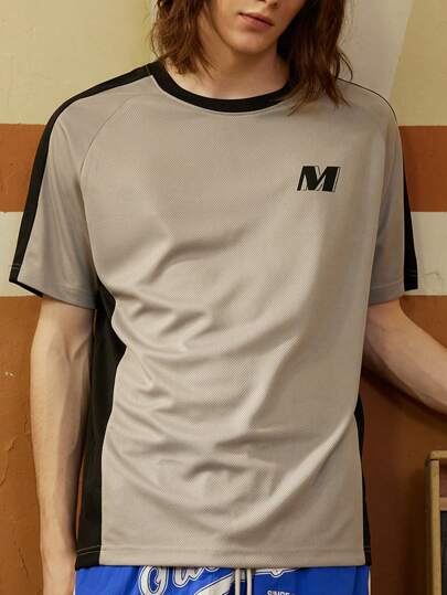 Manfinity Sport Corelite Camiseta casual de manga corta estilo novio para hombre, con estampado de letra empalmado sólido y diseño deportivo