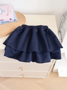 SHEIN Genkimix Kids Young Girl 2 In 1 Outfit With Shirt Collar Sweatshirt And Layered Skirt. The Blouse Features A Shirt Collar Design, Simple And Generous, Paired With A Necktie Decoration For A Playful And Elegant Look. The Skirt Adopts An A-Line Layered Design, Light And Flowy, With The Hem Swaying In The Wind As You Walk, Showcasing The Liveliness And Vibrancy