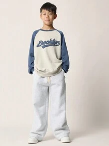 SUMWON Sudadera casual con estilo de béisbol de Brooklyn, diseño de letras retro con aplicación, manga raglán, ropa deportiva de otoño e invierno para adolescentes