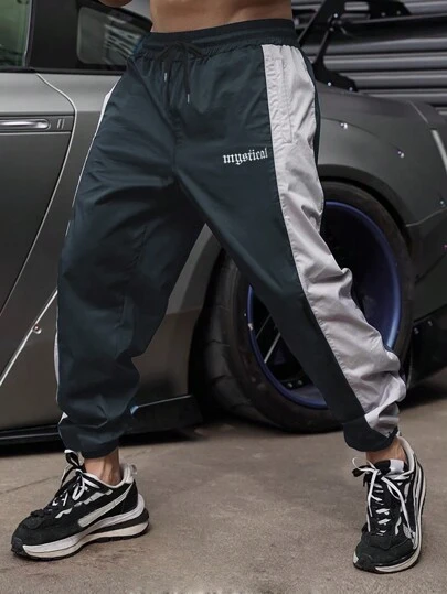 Manfinity Sport Corelite Pantalones deportivos de estilo novio con cintura con cordón y estampado de letras de color contrastante