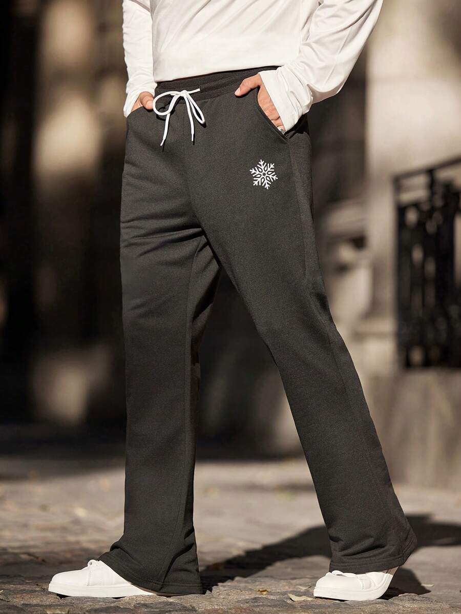 Manfinity EZcore Pantalones de chándal casuales con cordón y bolsillos para hombre, con estampado de copos de nieve