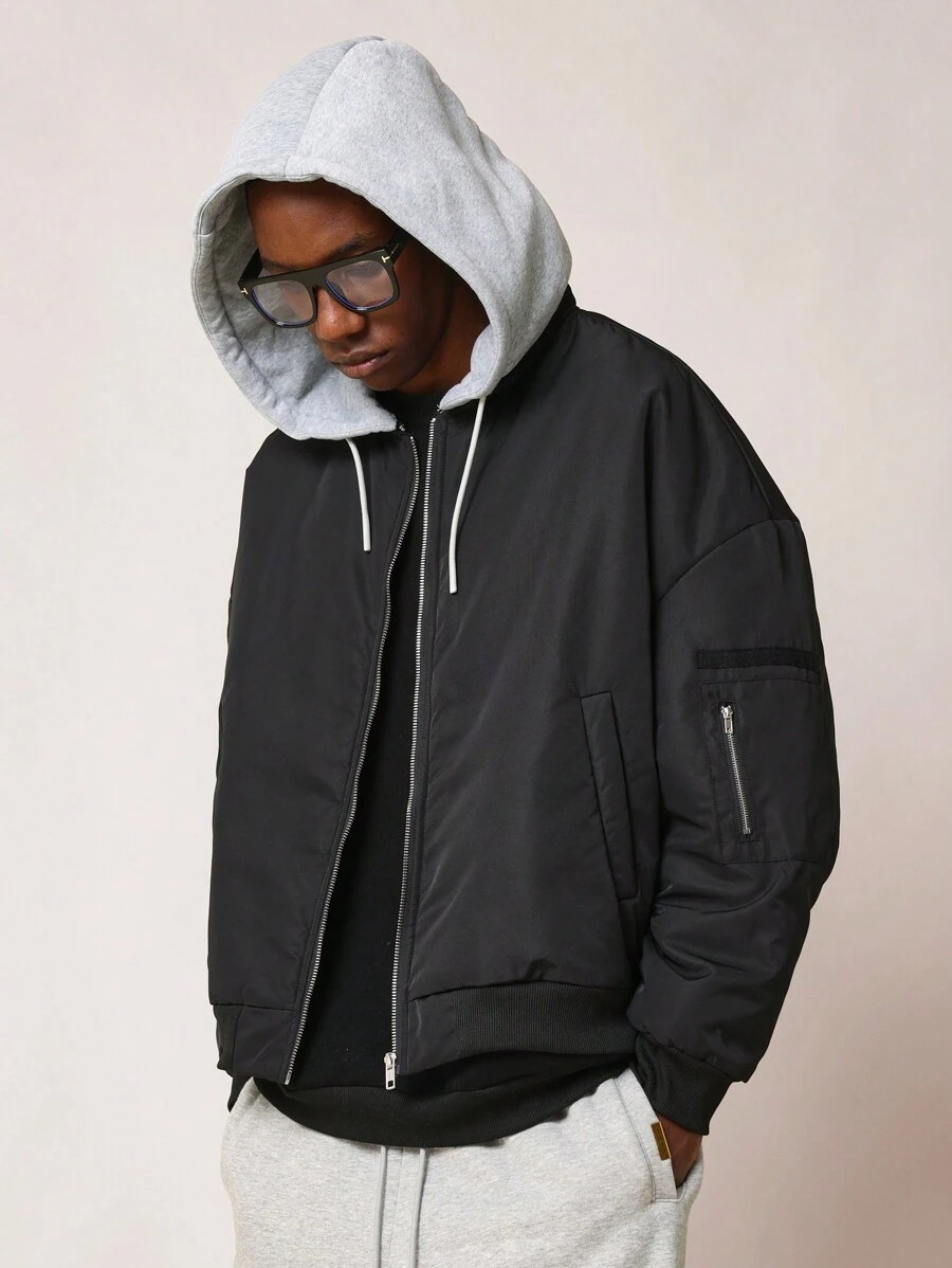 SUMWON Oversized Bomber Jacket With Removable Grey Hood Quilted Winter Flight Jacket Streetwear Athletic Zip Up Outerwear With Arm Pocket - Black - View 1
