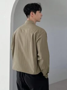 DAZY 1 pieza Camisa casual de un solo pecho con bolsillo utilitario de unicolor y manga larga para hombres, otoño
