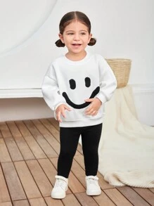 SHEIN مجموعة من سويت شيرت طويل الأكمام بتصميم وجه طفل بنات جميلة وبنطال ذو خصر مرن من القطن الحراري للخريف والشتاء، قطعتان - أبيض وأسود - مشاهدة 6