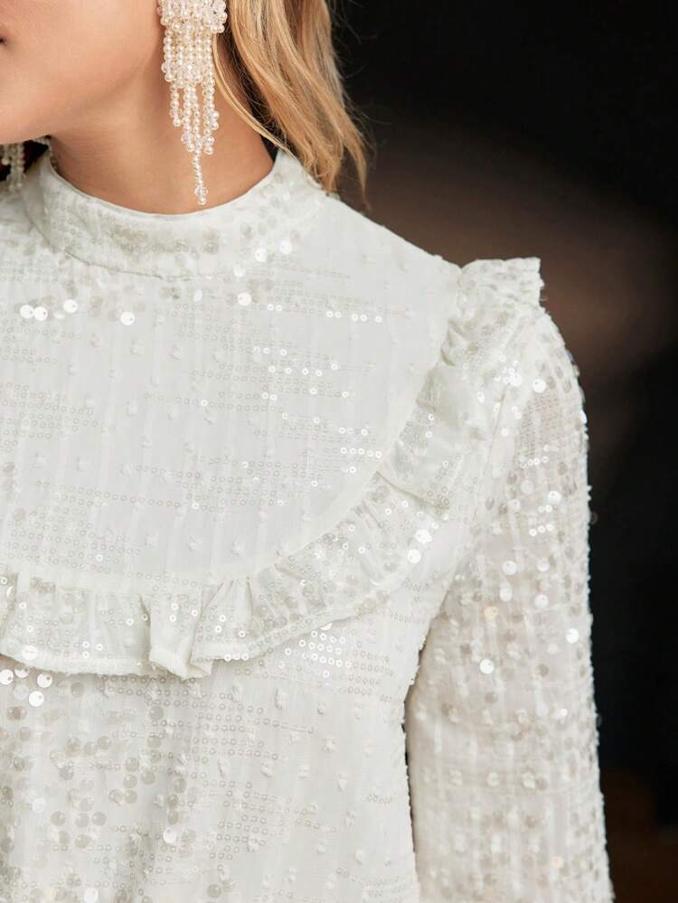 SEQUINS SOLID MOCK NECK FLARE SLEEVE RUFFLE TRIM PEPLUM TOP