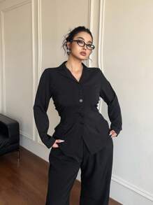 Flirla Blusa de manga larga elástica y ajustada de estilo universitario simple en negro para mujeres de talla grande