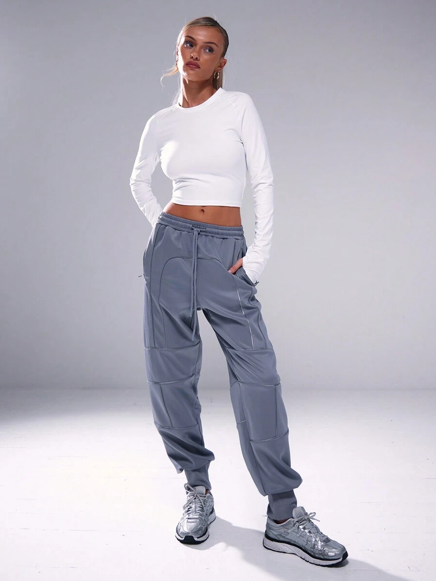 Musera Sport Pantaloni della tuta con cuciture riflettenti e polsini, adatti per padel, tennis, pickleball, palestra e fitness - Grigio - Visualizzare 1