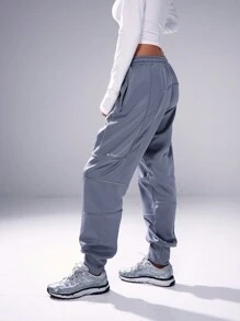 Musera Sport Pantaloni della tuta con cuciture riflettenti e polsini, adatti per padel, tennis, pickleball, palestra e fitness - Grigio - Visualizzare 3