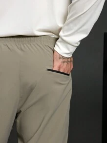 Manfinity Sport Corelite 1 pieza Pantalón deportivo informal suelto con bolsillo con cordón, estilo novio, unicolor para hombre