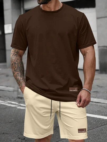 Manfinity Homme Conjunto informal de 2 piezas de talla grande para hombre, con camiseta de cuello redondo de unicolor y pantalones cortos, atuendo cómodo