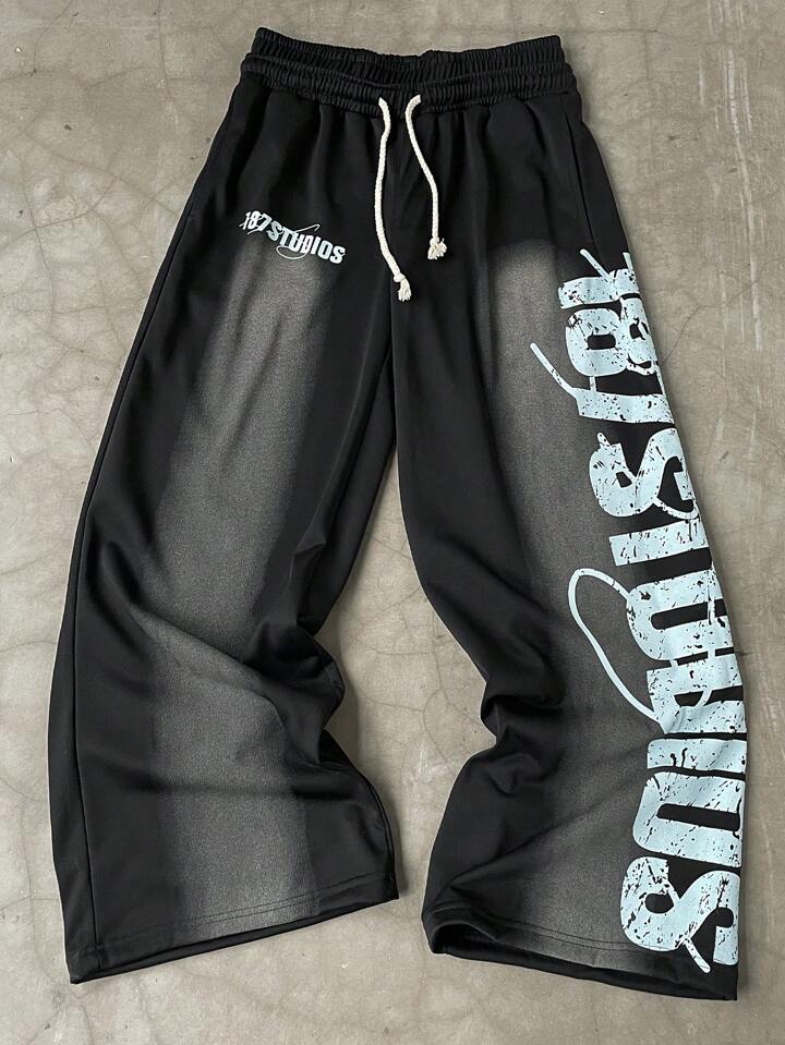 Manfinity EMRG Men's Casual Loose Pants With Front Lacing & Letter Graphic Print, Minimalist Design Going Out Long Street Wear Oversize Drawstring Sweatpants, For Husband, Boyfriend Gifts