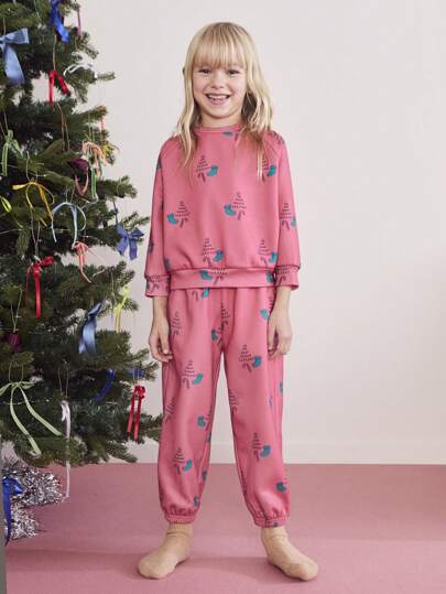 SHEIN Conjunto informal de 2 piezas para niñas jóvenes: Sudadera de cuello redondo de manga larga y pantalón de chándal con estampado navideño y de Año Nuevo de corte holgado para uso diario, otoño/invierno