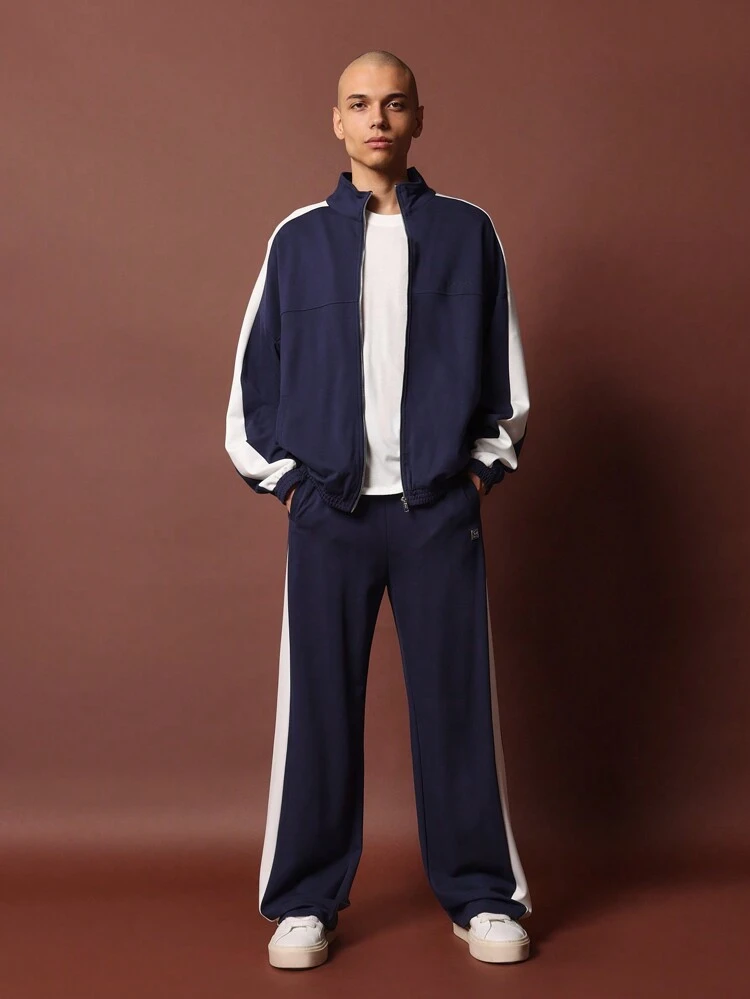 Tuta da jogging abbinata con zip frontale e striscia laterale