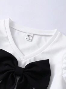 SHEIN Conjunto de blusa de cuello en V con moño y pantalones rectos de unicolor para niña preadolescente, de moda y divertido, adecuado para todas las estaciones - Blanco y Negro - Ver 7