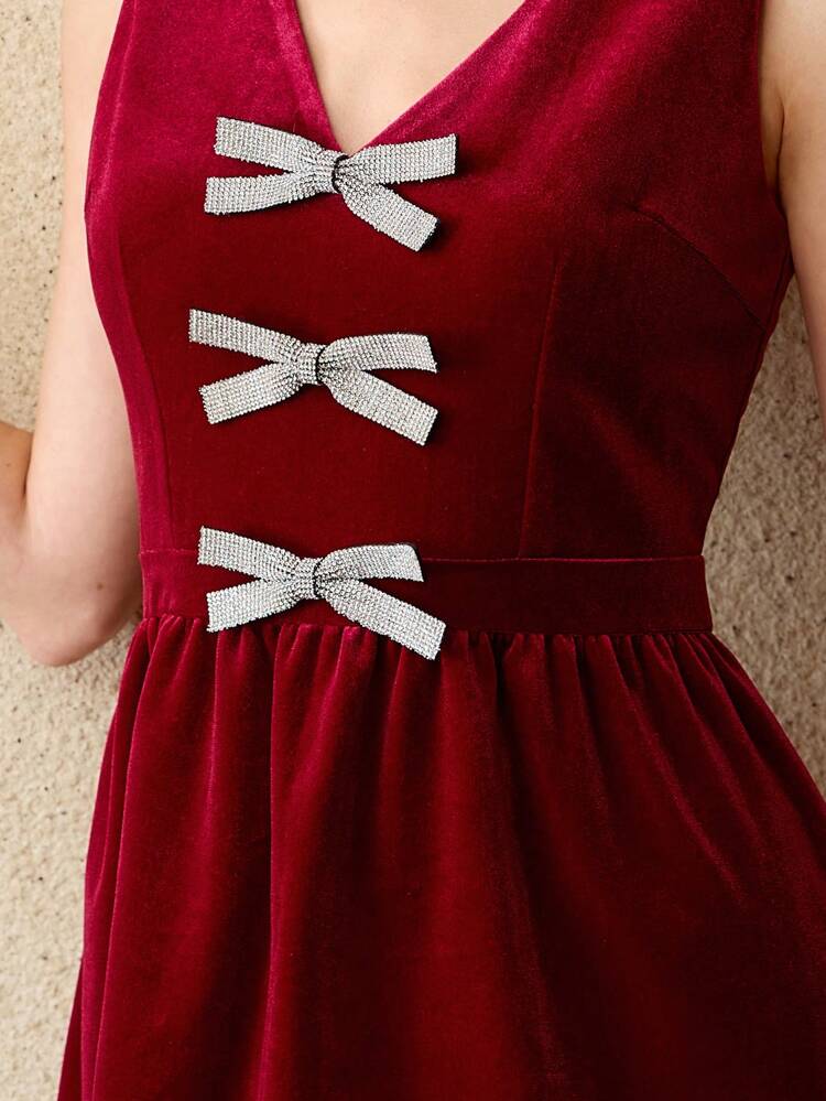 VELVET V-NECK RHINESTONE BOW FRONT SLEEVELESS DRESS