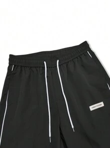 Chillumni 宽松男士字母拼接细节撞色滚边抽绳腰带裤，适合秋季 - 黑色 - 查看 5