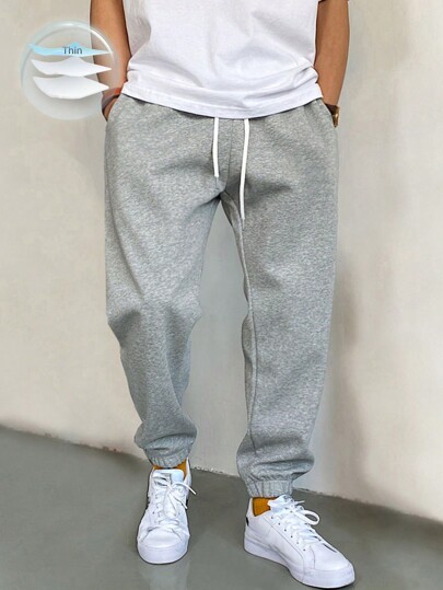 Manfinity Homme Pantaloni de trening pentru bărbați, cu buzunar oblic și șnur în talie, lungi, gri deschis, simpli, casual, pentru ieșiri în oraș