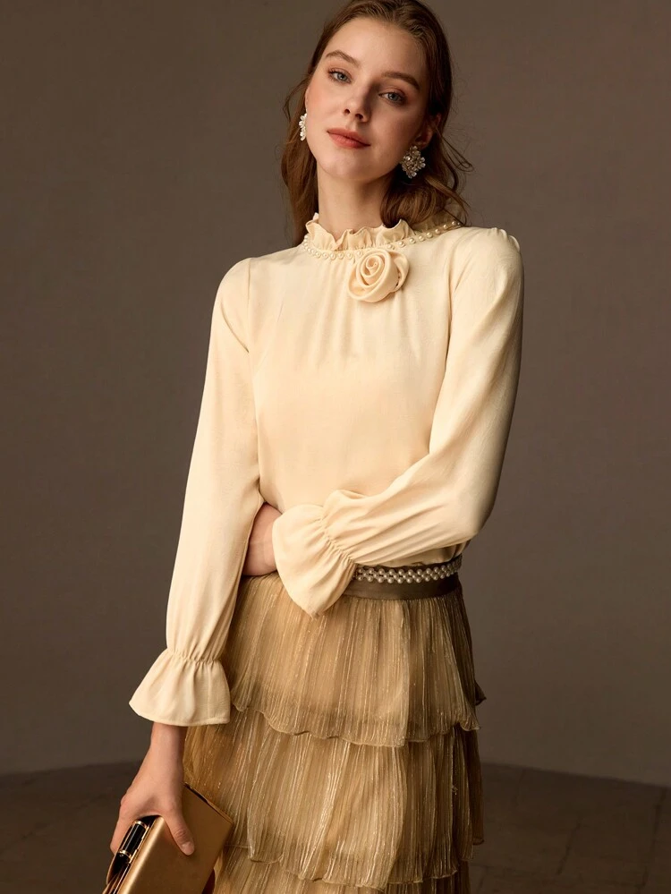 FRILL MOCK NECK STEREO FLOWER DETAIL FLARE SLEEVE BLOUSE