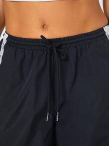 SHEIN SXY Pantalones casuales de mujer con abertura, impresión digital blanca y encaje en la espalda, para actividades deportivas de ocio diarias