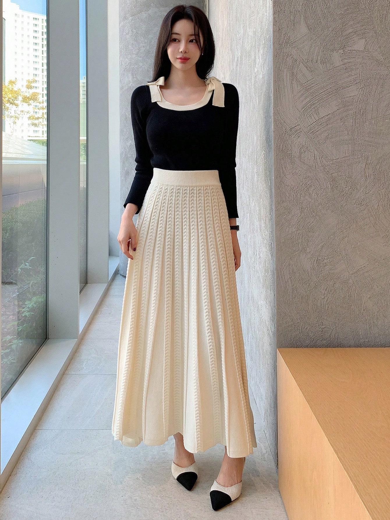 تنورة ذات خصر عالي مطوية بلون أحادي