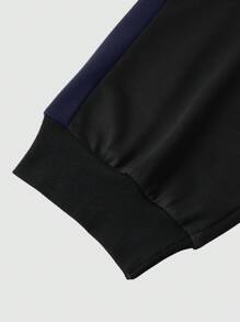 Manfinity LEGND Conjunto de sudadera de manga larga con cuello redondo y bicolor y pantalón de chándal liso con cordón para hombres talla grande