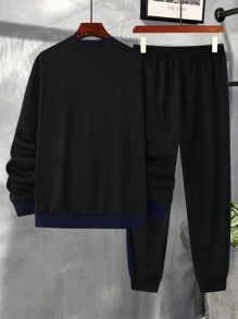 Manfinity LEGND Conjunto de sudadera de manga larga con cuello redondo y bicolor y pantalón de chándal liso con cordón para hombres talla grande