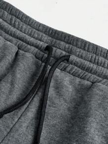 Pantaloni della tuta neri svasati con stampa floccata per ragazze adolescenti, vestibilità morbida, stile athleisure, gamba dritta con laccetto, perfetti per la casa e il tempo libero