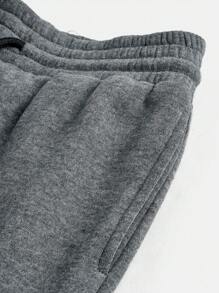 Pantaloni della tuta neri svasati con stampa floccata per ragazze adolescenti, vestibilità morbida, stile athleisure, gamba dritta con laccetto, perfetti per la casa e il tempo libero