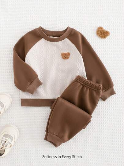 Cozy Pixies Set de 2 piezas con Top de cuello redondo y mangas tipo raglán de color contrastante, y pantalones con puños para bebé niño