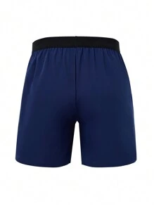 Manfinity Sport Corelite Shorts deportivos de estilo novio con bolsillo con cremallera, cintura elástica y color contrastante para hombre