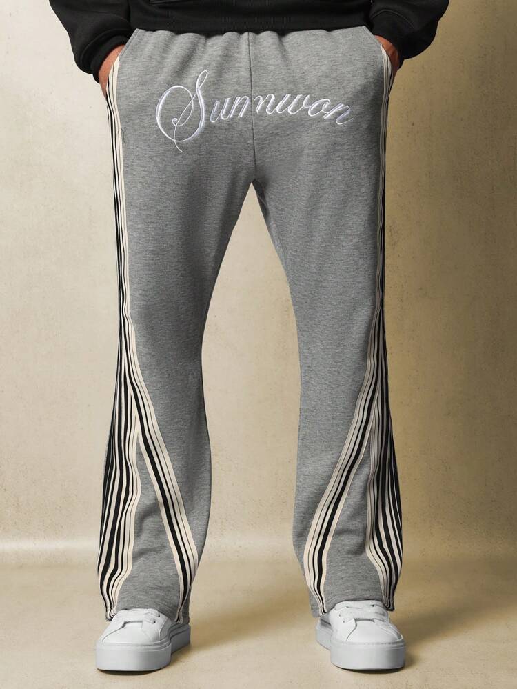 Pantalon de survêtement rétro évasé à rayures latérales