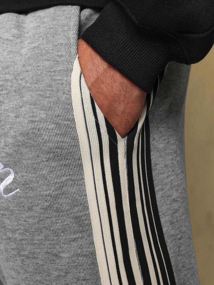 Pantalon de survêtement rétro évasé à rayures latérales