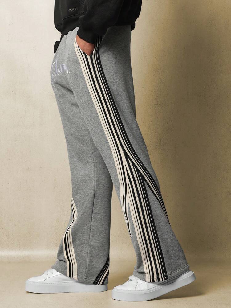 Pantalon de survêtement rétro évasé à rayures latérales