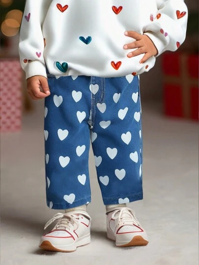 Jeans anchos de media azul desgastados de cintura elástica con estampado de corazón lindo para bebés niñas