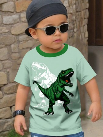 SHEIN Young Boy Casual Minimalist Cool Dinosaur Graphic Round Neck Loose Fitting Short Sleeve T-Shirt, Suitable For Summer