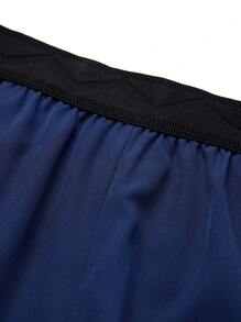 Manfinity Sport Corelite Shorts deportivos de estilo novio con bolsillo con cremallera, cintura elástica y color contrastante para hombre