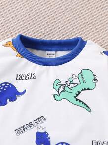 Set de 2 piezas con sudadera y pantalón jogger con estampado de dinosaurios de dibujos animados en estilo universitario casual para niño, cómodo y versátil para uso diario