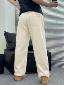 Manfinity Dauomo Pantalones casuales de bolsillo con nudo delantero de color liso para hombres, para uso diario