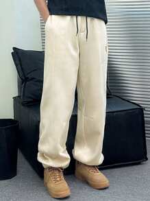 Manfinity Dauomo Pantalones casuales de bolsillo con nudo delantero de color liso para hombres, para uso diario
