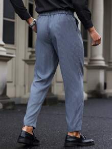 Manfinity Mode Pantalones casuales/de oficina de vestir con rayas y pliegues para hombre