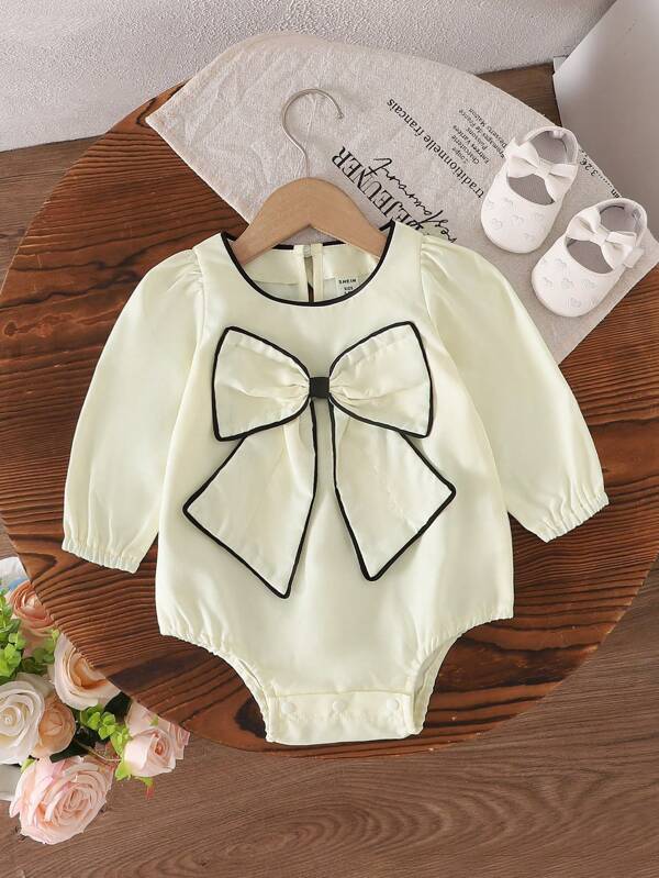 Macacão infantil feminino casual outono/inverno com laço grande e manga comprida em bege