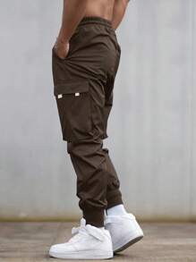 Manfinity EMRG Pantalones cargo para hombres con gráfico de lema, bolsillo con solapa y cintura con cordón